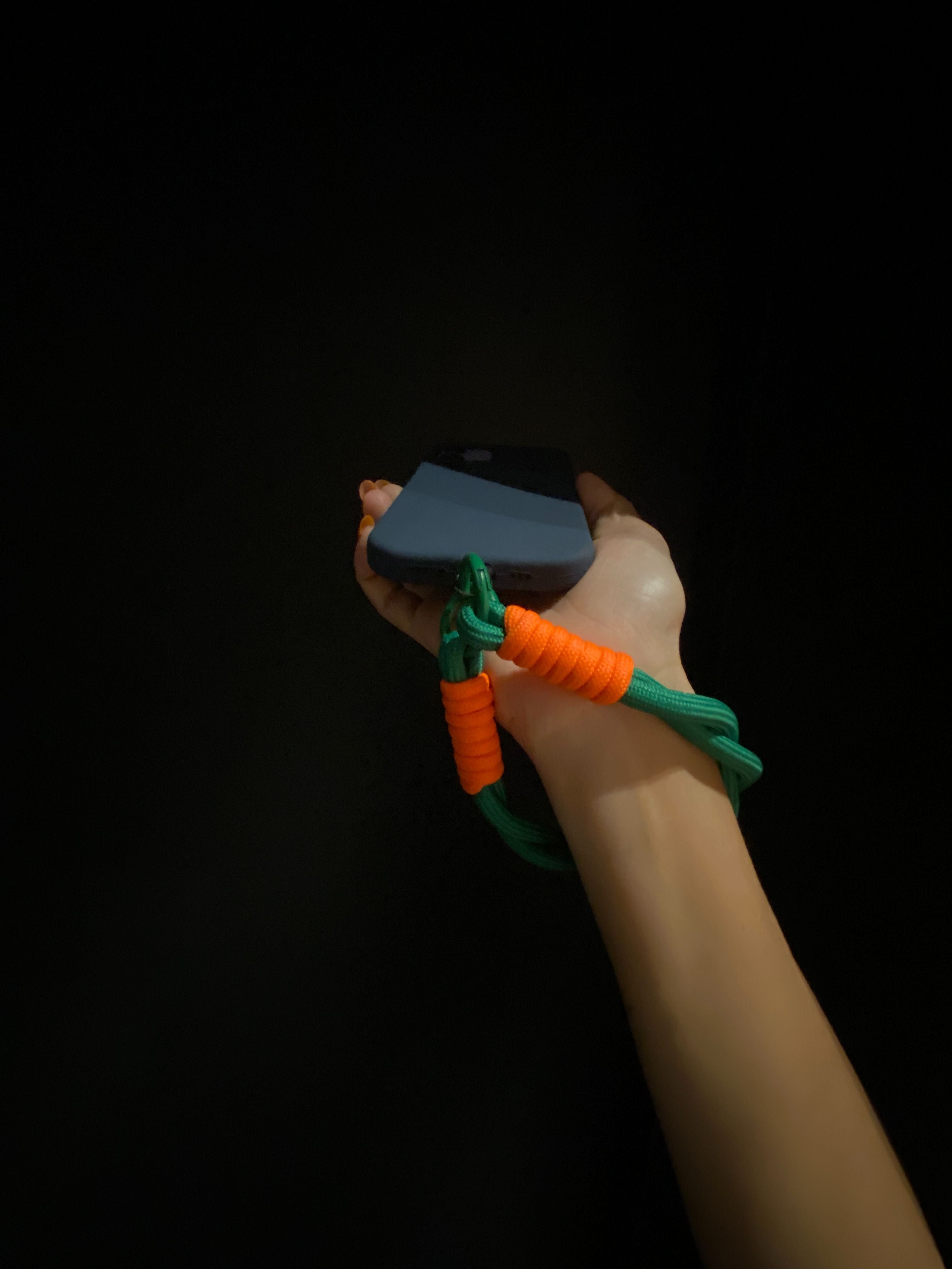 Jabees Nylon Wrist Strap – green and orange color lifestyle photo